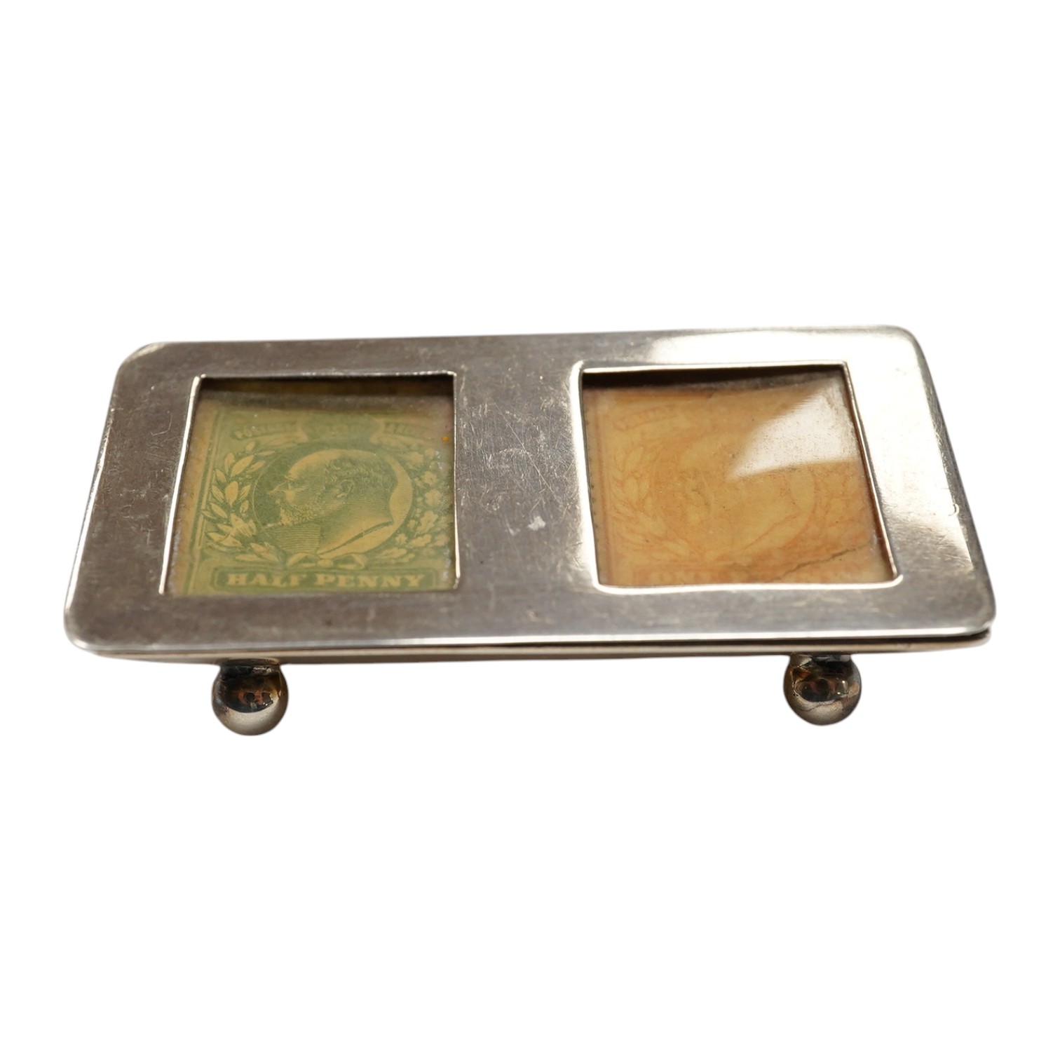 An Edwardian silver twin compartment stamp case, Deakin & Francis, Birmingham, 1902, 61mm. Condition - fair